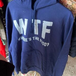 Blue, large sweatshirt with writing that says “WTF where’s the food”